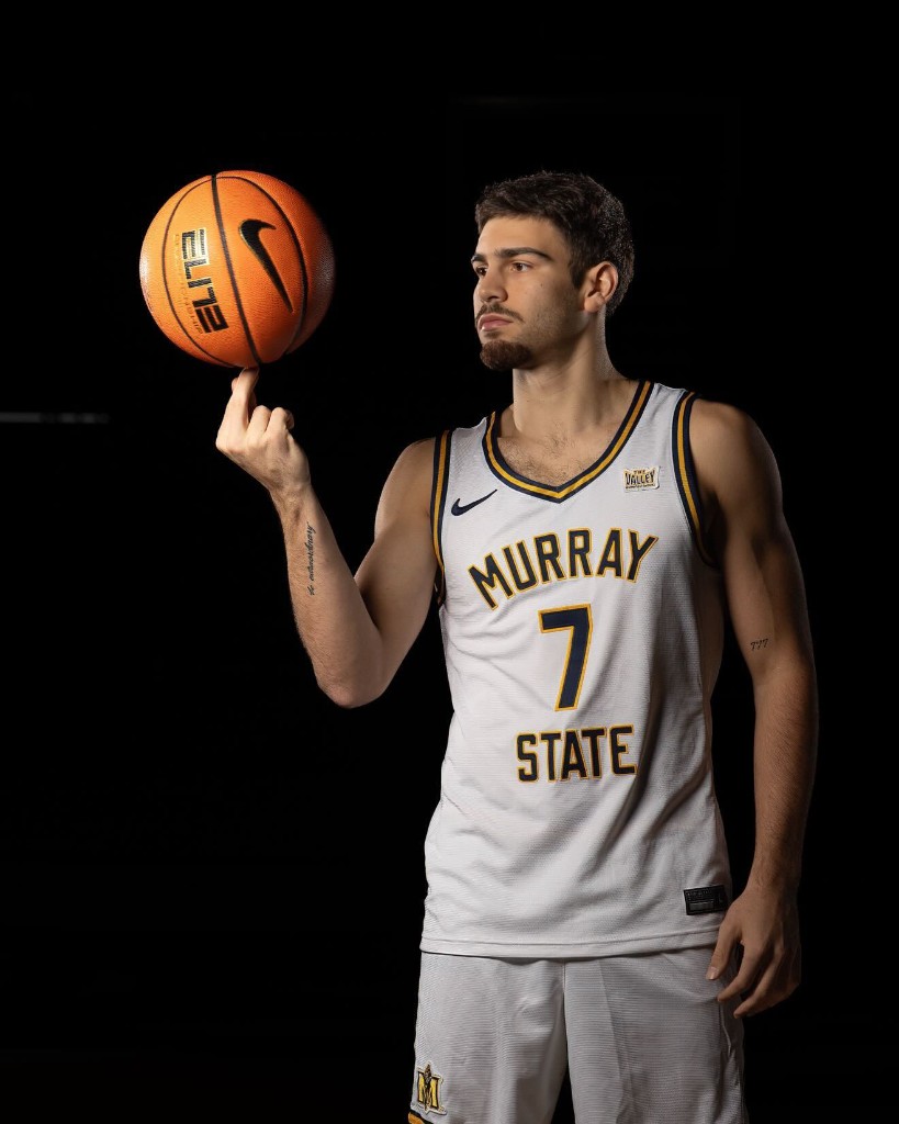 Ben Shtolzberg spinning a basketball on his finger in a Murray State jersey